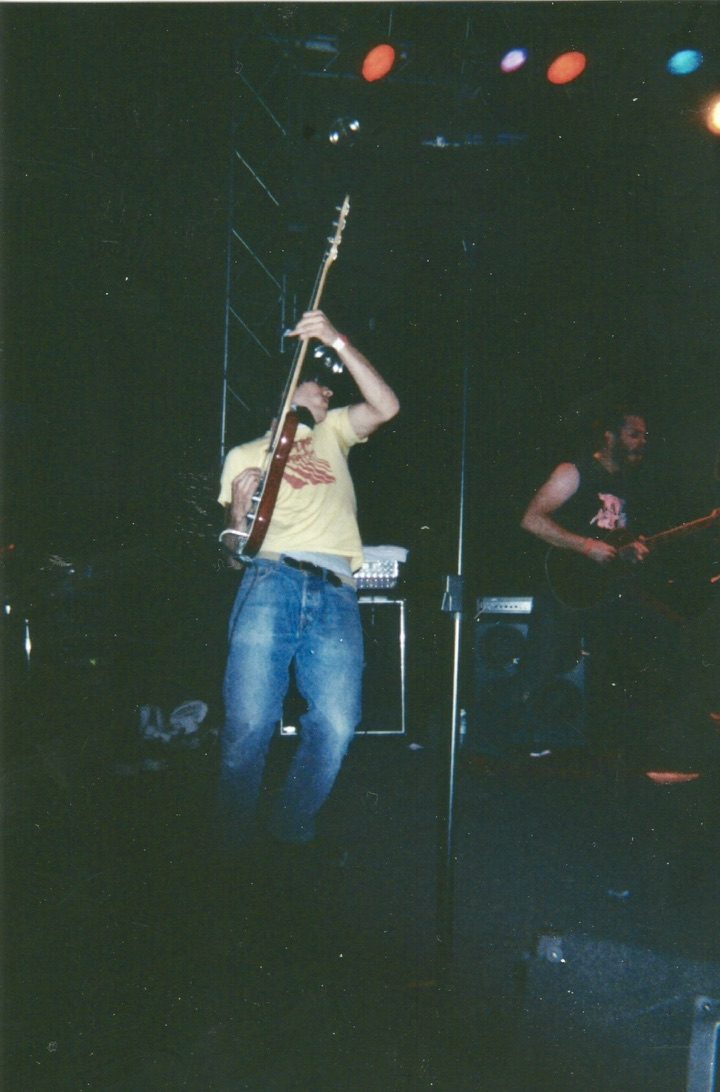The Temptation Of Saint Anthony guitarist live on stage under lights