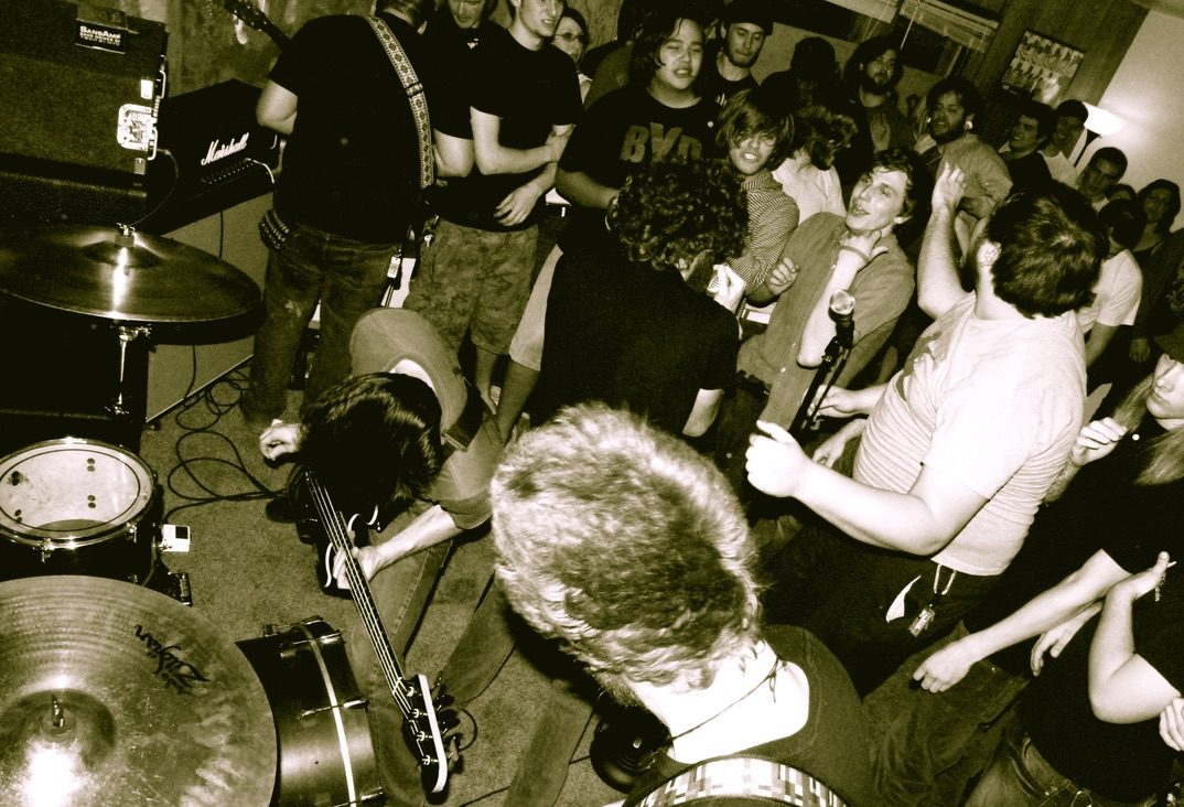 The TOSA crowd and band performing live